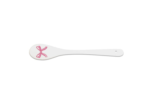 Porcelain spoon with ribbon.